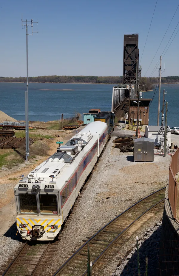 An elevated view of FRA DOTX 219 beside the Wheeler Lake railroad bridge.