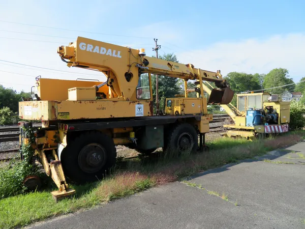 Yellow track maintenance machinery beside the railroad in Ware, Massachusetts.